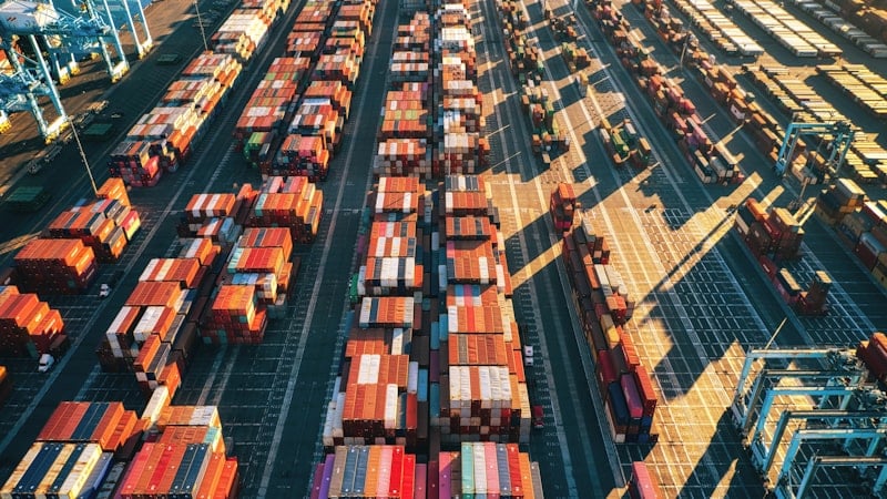 Aerial view of a container port stacked with freight