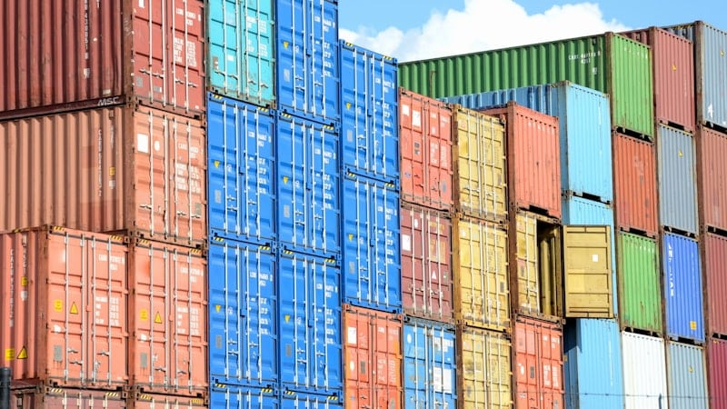 Stacked shipping containers in red, blue and yellow